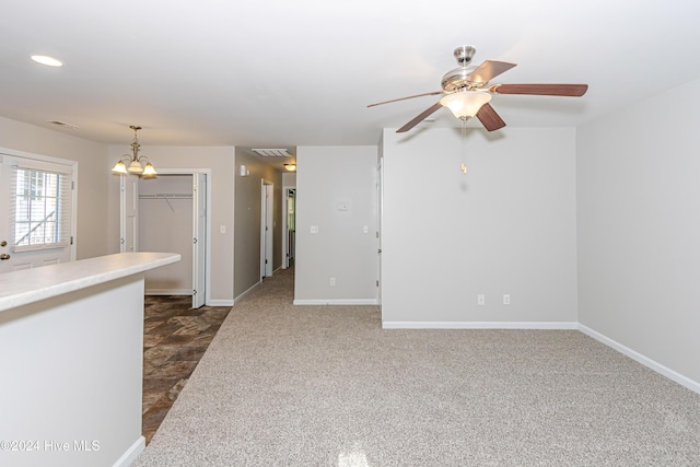 105 James Ave Unit A, Surf City, NC 28445 - spare room featuring ceiling fan, baseboards, a chandelier, and dark colored carpet