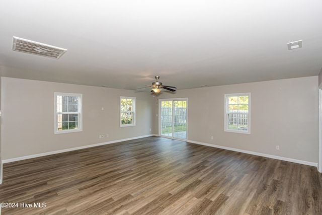 105 James Ave Unit A, Surf City, NC 28445 - spare room featuring dark wood-style floors, baseboards, and a ceiling fan