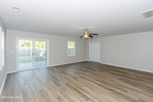 spare room with light hardwood / wood-style floors and ceiling fan