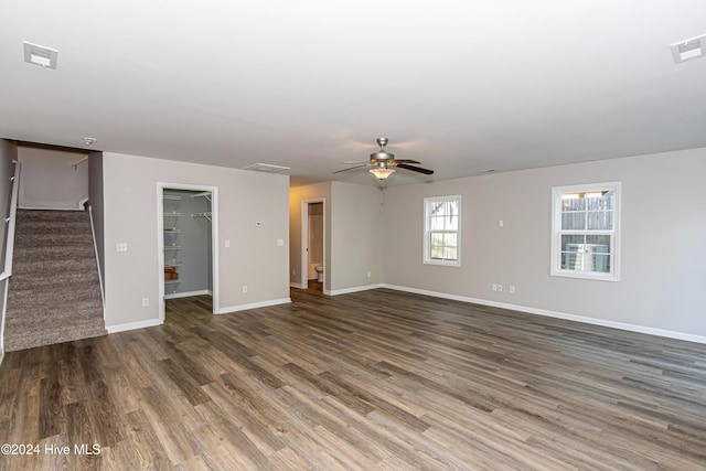 105 James Ave Unit A, Surf City, NC 28445 - unfurnished living room with wood finished floors, stairs, baseboards, and a ceiling fan