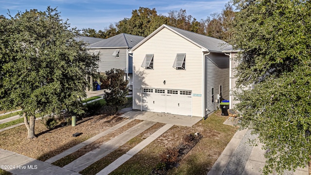 view of side of home featuring a garage