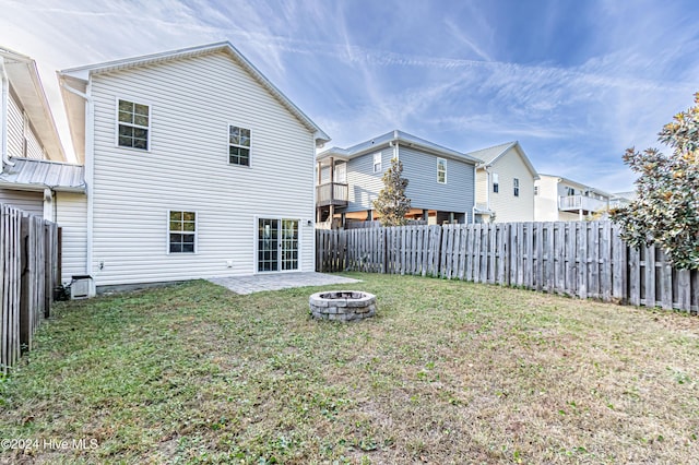 105 James Ave Unit A, Surf City, NC 28445 - rear view of property featuring a fire pit and a residential view
