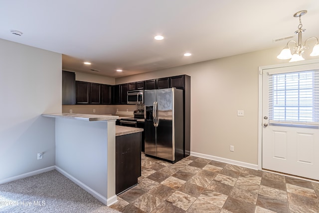 kitchen featuring stainless steel appliances, kitchen peninsula, decorative light fixtures, dark brown cabinets, and a chandelier