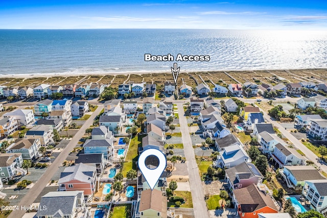 bird's eye view featuring a beach view and a water view