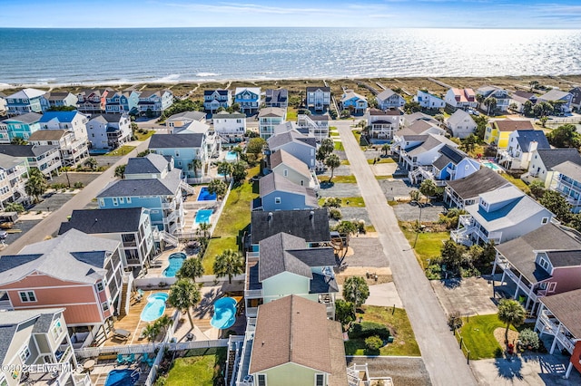 bird's eye view with a beach view and a water view