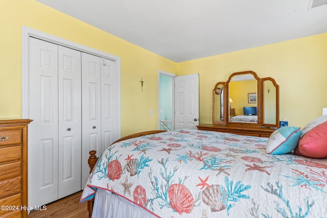 bedroom featuring a closet and hardwood / wood-style flooring