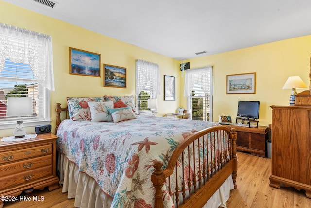 bedroom with light wood-type flooring