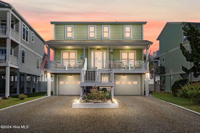 view of front facade featuring a garage and covered porch