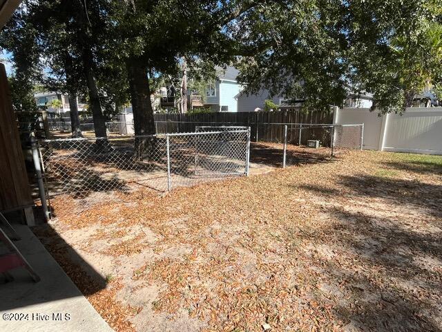 138 NW 17th St, Oak Island, NC 28465 - view of fenced backyard