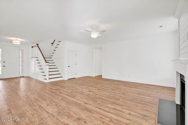 unfurnished living room with light hardwood / wood-style flooring and ceiling fan