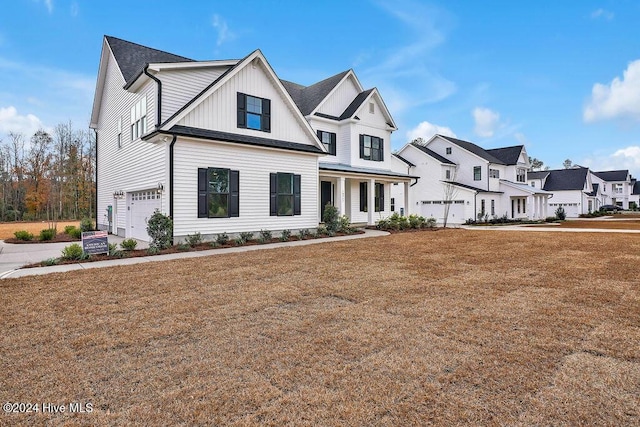 view of front of house with a porch and a garage