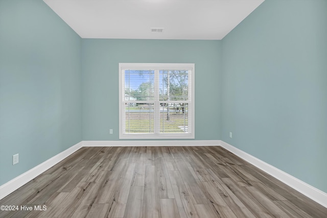 spare room featuring light hardwood / wood-style flooring