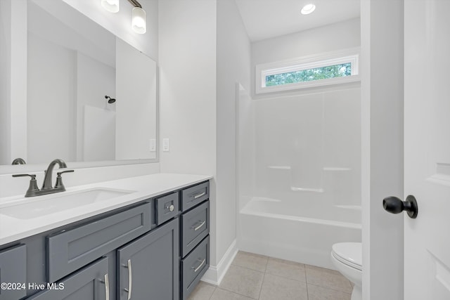 full bathroom featuring shower / washtub combination, tile patterned flooring, vanity, and toilet