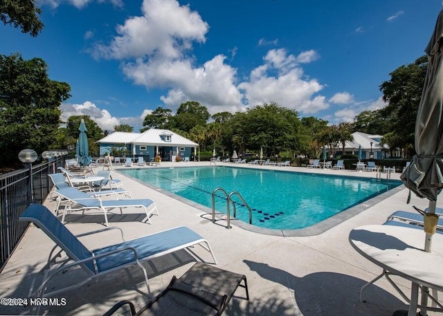 view of swimming pool featuring a patio area