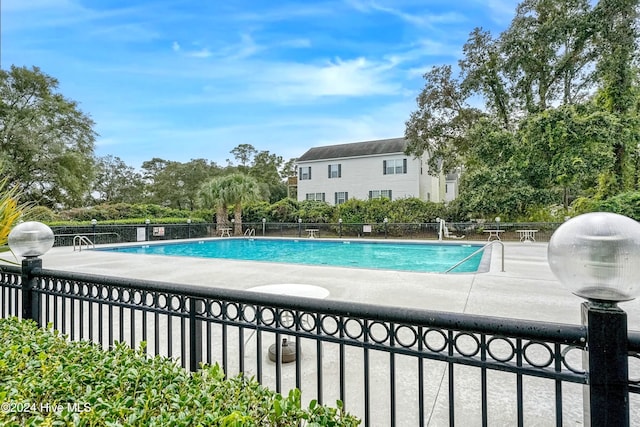 view of swimming pool with a patio