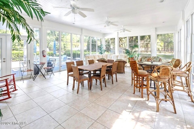 sunroom with ceiling fan and a healthy amount of sunlight