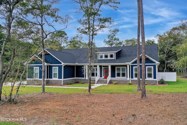 craftsman-style home featuring a front lawn