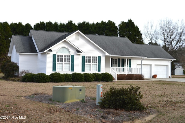 view of front of home with a porch and a garage