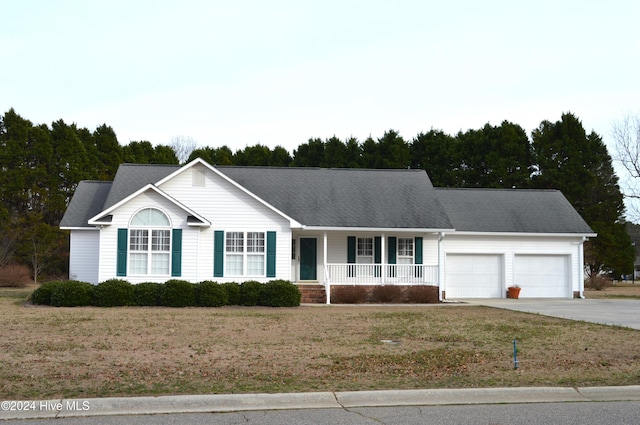 ranch-style house with a front lawn, a garage, and a porch