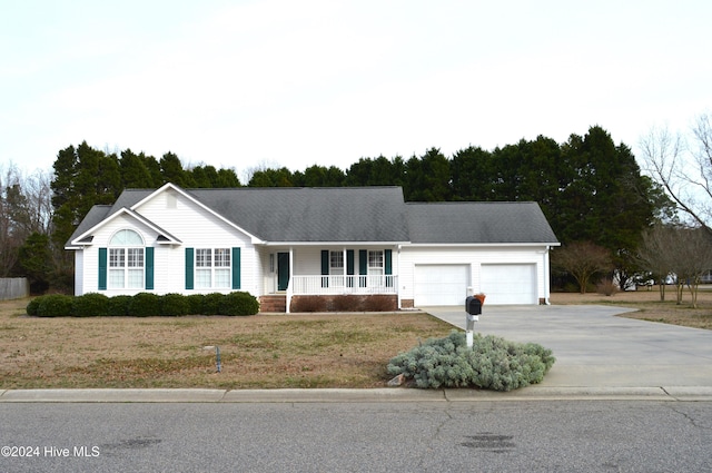 ranch-style home with a garage and covered porch