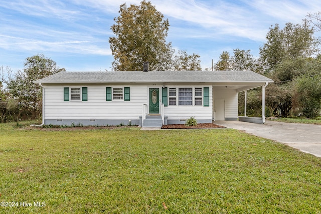 ranch-style house featuring a front yard and a carport