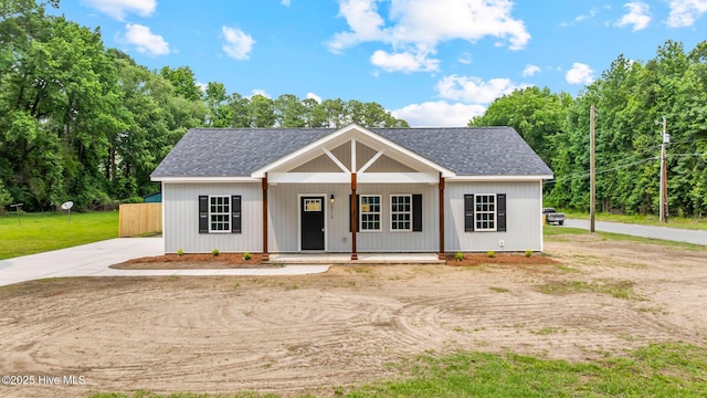 2013 E Hawthorne St, Goldsboro, NC 27530 - view of front of property with covered porch and a shingled roof