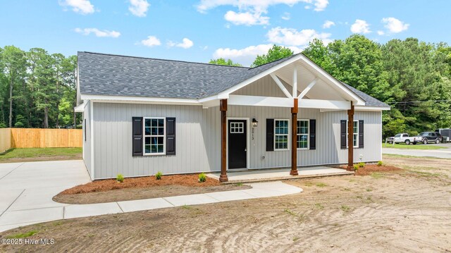 2013 E Hawthorne St, Goldsboro, NC 27530 - modern inspired farmhouse featuring a porch and a shingled roof