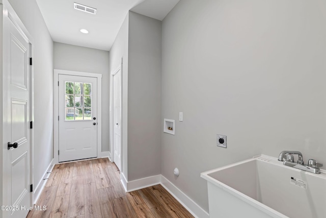 2013 E Hawthorne St, Goldsboro, NC 27530 - laundry room with electric dryer hookup, light wood-type flooring, baseboards, washer hookup, and recessed lighting