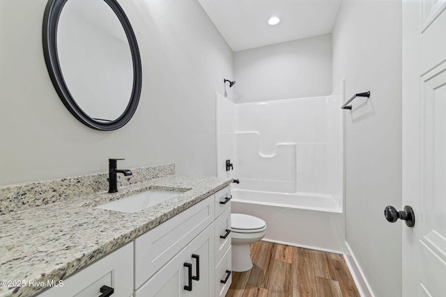 2013 E Hawthorne St, Goldsboro, NC 27530 - bathroom featuring toilet, vanity, wood finished floors, bathtub / shower combination, and recessed lighting