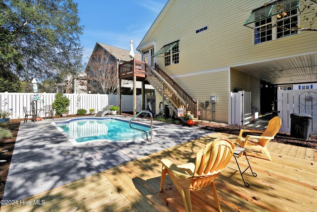 view of pool with a wooden deck