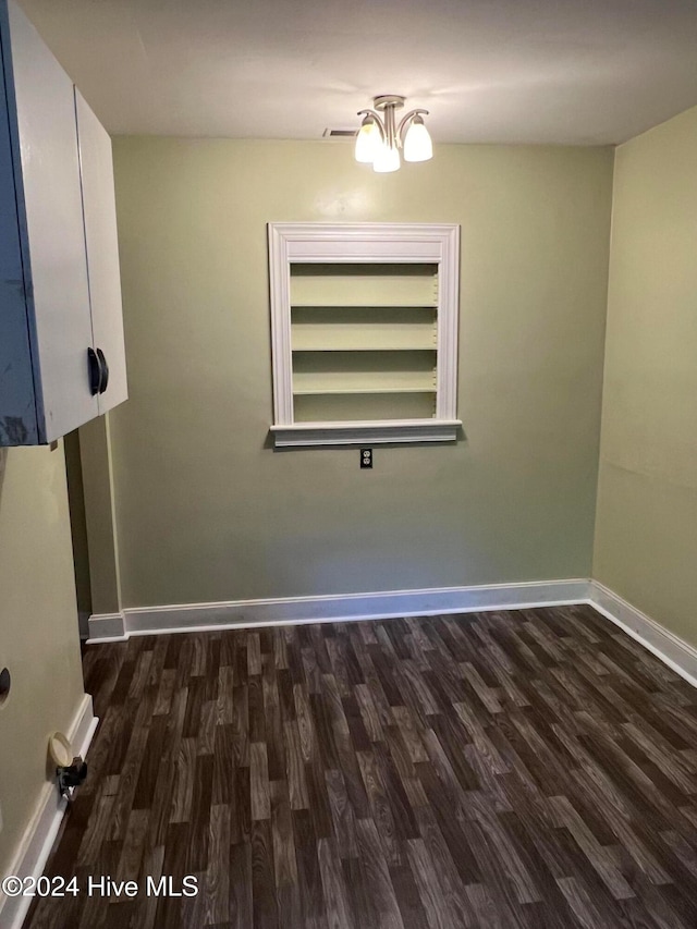 unfurnished room featuring dark hardwood / wood-style flooring