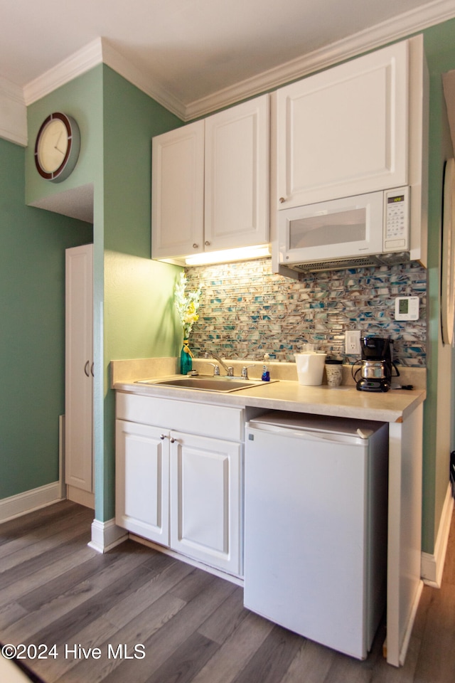 kitchen with dark wood-type flooring, white cabinetry, and sink