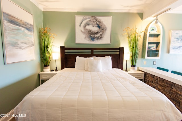 bedroom with ornamental molding