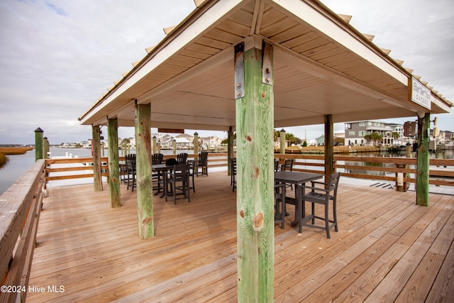 view of dock featuring a deck with water view