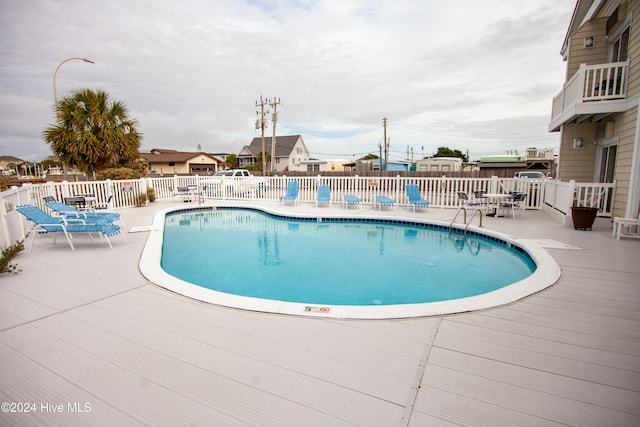 view of pool featuring a patio