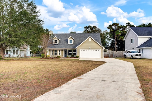 view of front facade with a garage, a porch, and a front yard