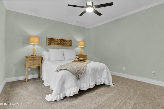 bedroom with ornamental molding, ceiling fan, and carpet