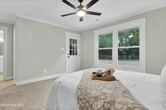 bedroom with crown molding, carpet floors, and ceiling fan