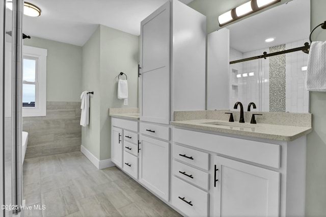 bathroom with vanity and walk in shower