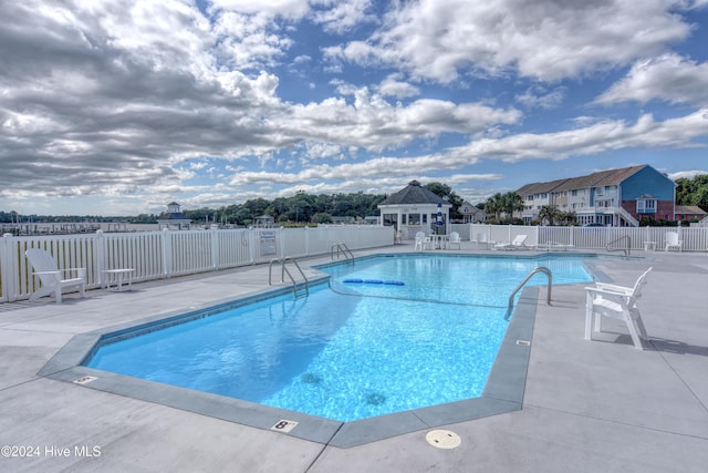 view of pool featuring a gazebo and a patio area