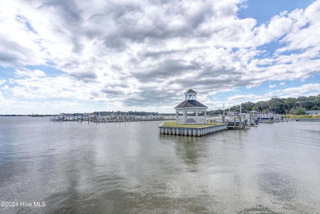 property view of water featuring a gazebo and a boat dock