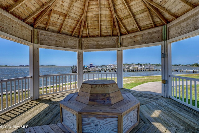 wooden terrace with a gazebo and a water view