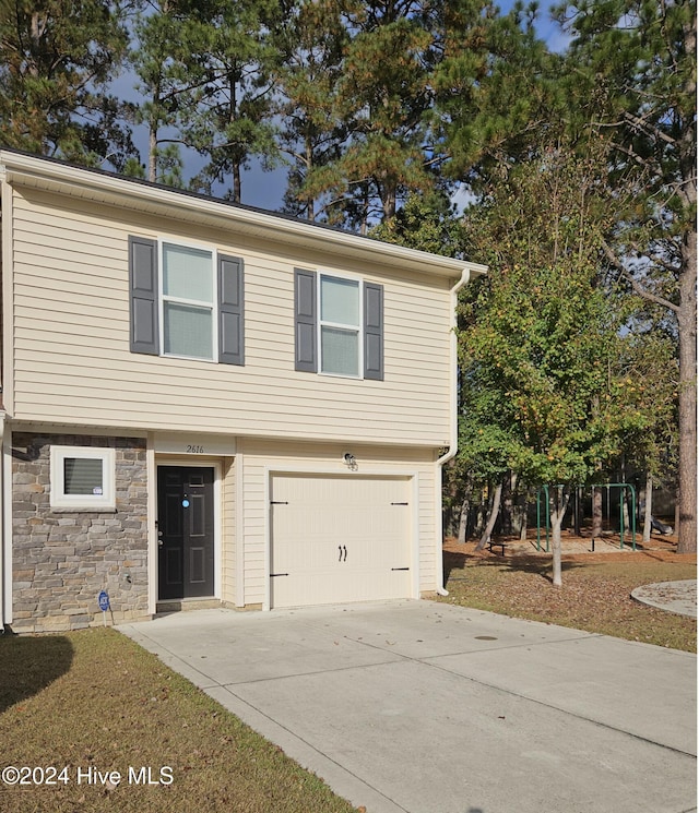 view of front of property featuring a garage