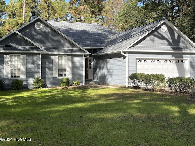 single story home with a front lawn and a garage