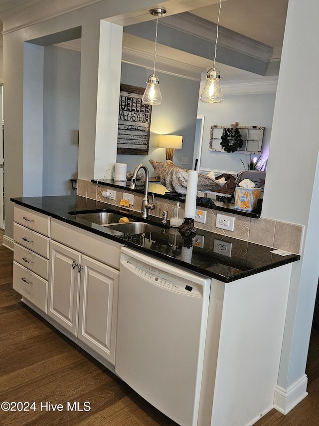 kitchen with a sink, ornamental molding, dark wood-style flooring, and white dishwasher