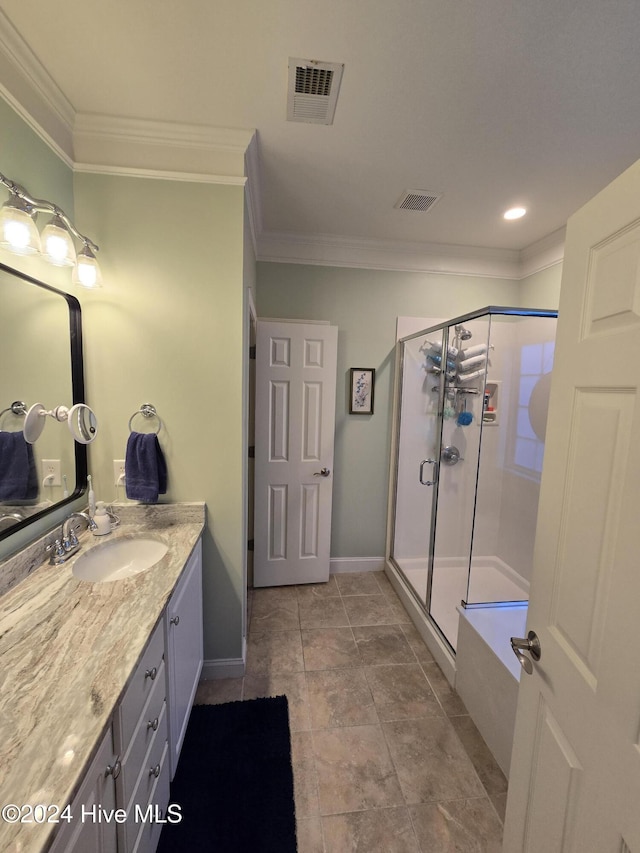 bathroom with visible vents, ornamental molding, a shower stall, baseboards, and vanity