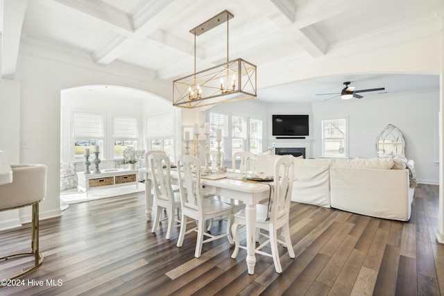 dining area with dark wood-style floors, a fireplace, and coffered ceiling