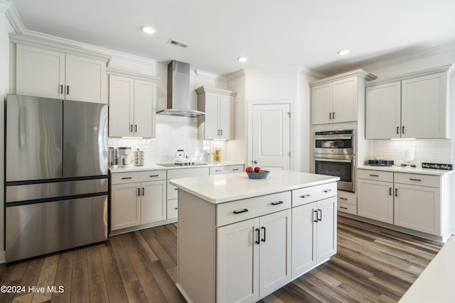 kitchen with stainless steel appliances, visible vents, wall chimney exhaust hood, and dark wood-style flooring