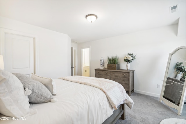 bedroom with baseboards, visible vents, and light carpet