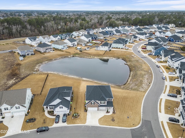 birds eye view of property featuring a residential view and a water view